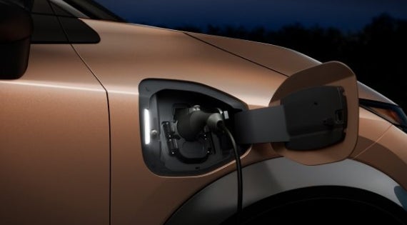 Close-up image of charging cable plugged in | Wallace Nissan of Kingsport in Kingsport TN